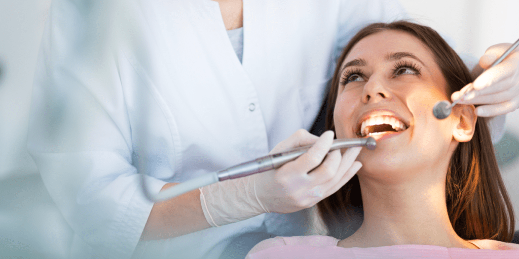 Dentist working on patient, cosmetic dentist