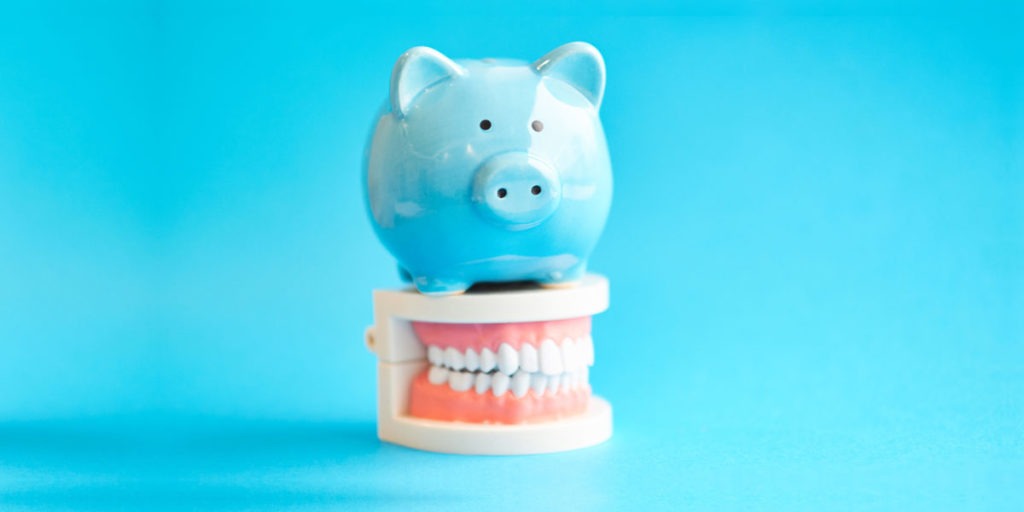 Piggy Bank and Dentures showing cost of dentures